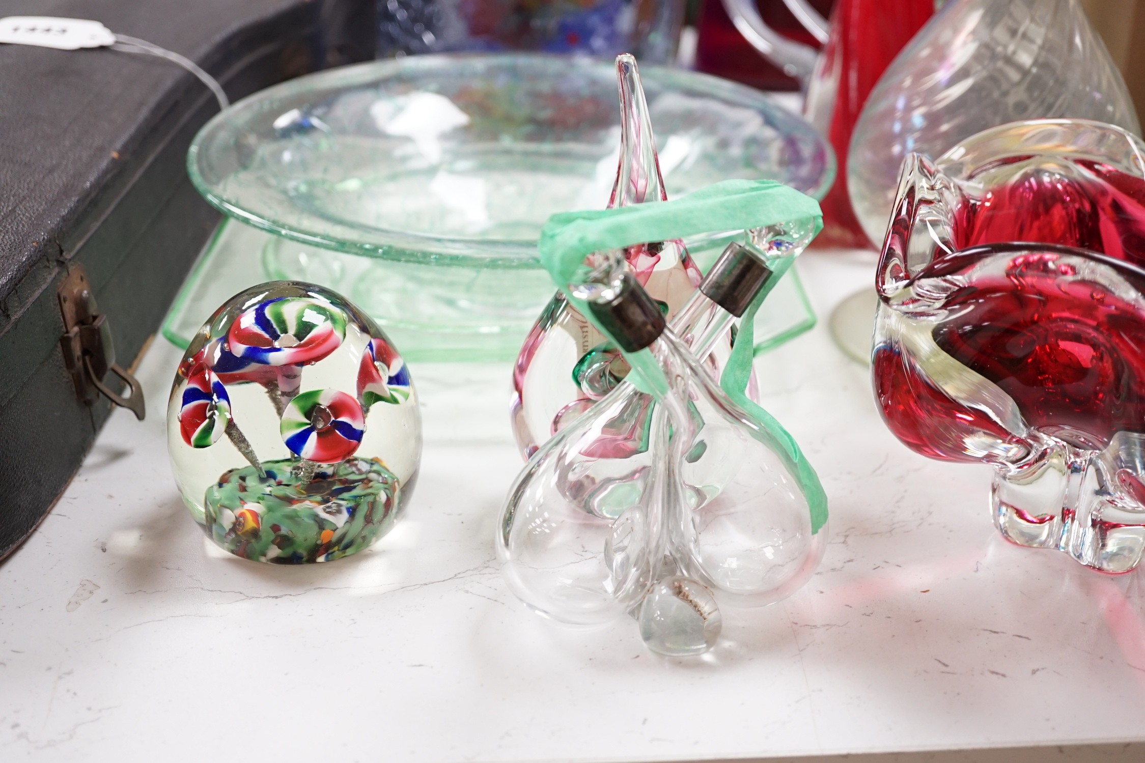 A large group of mixed art glass and other coloured glass vases, bowls, paperweights and two stoppered bottles etc, tallest 65cms high